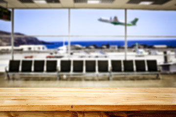Desk of free space and airport background 