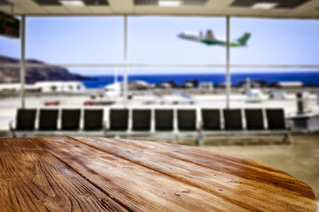 Desk of free space and airport background 