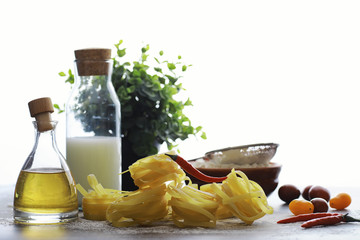 Pasta uncooked on the table. Noodles in the form of nests.