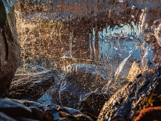 Blurred image formed by a falling wall of water. A variety of water figures in the waterfall....
