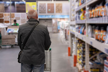 the man is shopping in the hardware store