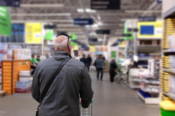 the man is shopping in the hardware store