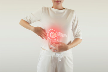 Digital composite of highlighted red pancreas of woman - obrazy, fototapety, plakaty