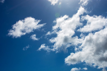 Naklejka na ściany i meble Blue sky with white clouds high contrast, cumulus