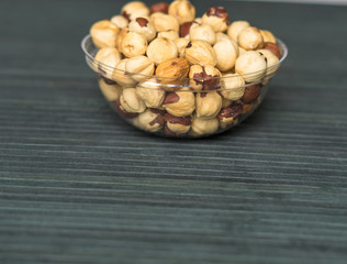 Healthy food  for background image close up hazelnuts.  Nuts texture on top view on the cup plate