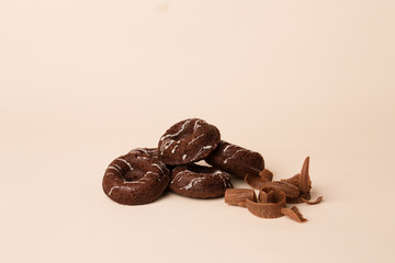 Chocolate cookies on white rose background 