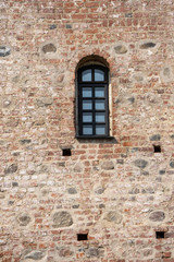Fototapeta na wymiar Mir, Belarus, April 24, 2019: The wall with the window, the ancient castle, stone walls