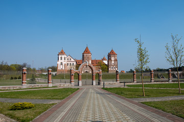 Fototapeta premium Mir castle, a monument of architecture, a brick fortress on the banks of the lake