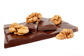 dark chocolate bar with walnuts on a white background