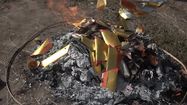 Burning Chinese joss paper for worship