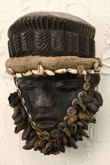 West African wood carved Dan Ceremonial dance mask with shells