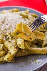 pasta pesto on a white wooden background