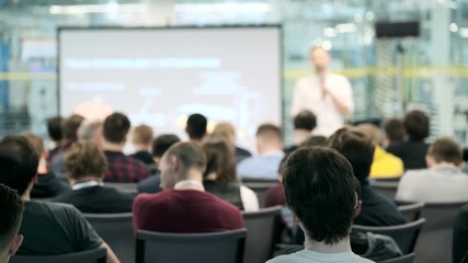 Audience listens to the lecturer at the conference