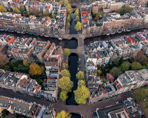 Aerial of the Amsterdam canals with classic canal houses and beautiful historic architecture