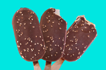 Ice cream are isolated by a close up on a blue background.