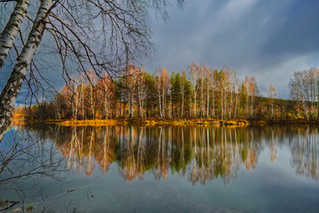 Autumn landscape sunny warm day in the forest by the river