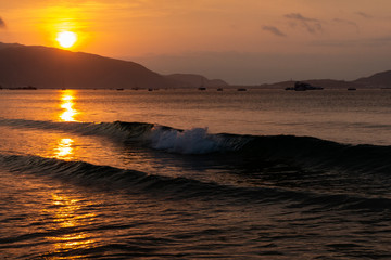 Watching golden sunrise at Sanya Beach, Hainan Island, China