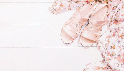 summer women's sandals on white background top view. copy space. summer clothes. summer sandals flat lay.