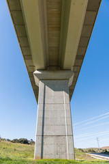 Views from below of an overpass of the train tracks near Grimaldo