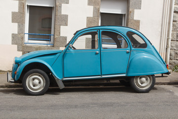 Vintage car parked in a street in France