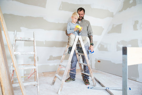 Father and son working on loft conversion