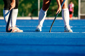 Hockey being played on a modern astro turf field