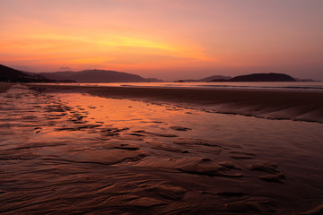 Watching golden sunrise at Sanya Beach, Hainan Island, China