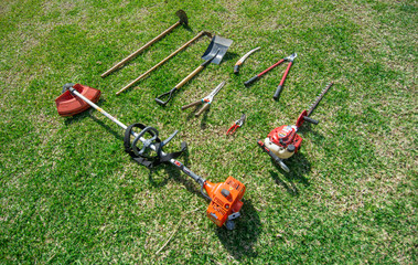 Gardening Tools on grass green background.
