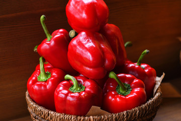 Colourful peppers, red, yellow and green.Their name are bell pepper, sweet pepper or capsicum.Vegetables in a basket, organic food and fresh vegetables.