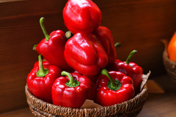 Colourful peppers, red, yellow and green.Their name are bell pepper, sweet pepper or capsicum.Vegetables in a basket, organic food and fresh vegetables.