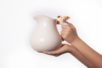Hand - ceramic jug isolated on white background