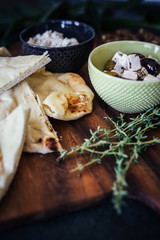 Closeup of Mediterranean Charcuterie board with Pita Bread and Cheese