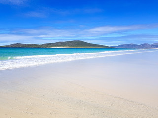 Fototapeta na wymiar White sandy beach and blue sea