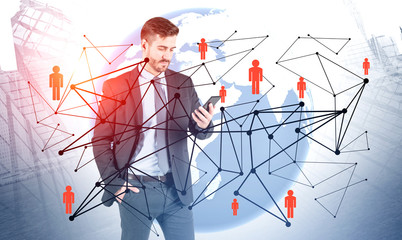 Businessman looking at phone, social media