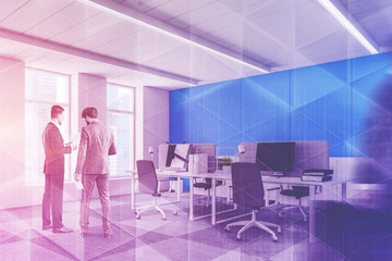 Businessmen in office with blue walls