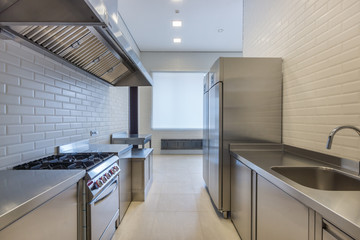 Interior of professional kitchen. Appliances for food preparation. Refrigerators