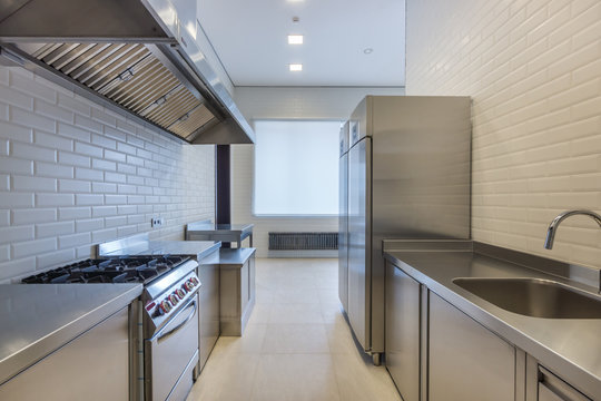 Interior Of Professional Kitchen. Appliances For Food Preparation. Refrigerators