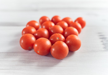 Cherry tomatoes on a clear wooden background, delicious and healthy