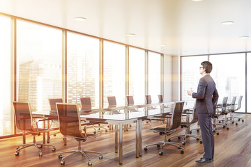 Businessman in panoramic conferece room