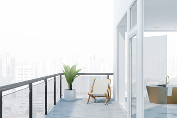Balcony with city view and white marble bathroom