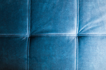 Naklejka premium Close-up Furniture fittings - upholstered sofa. Abstract blue texture, design