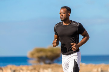 Black african american young man running outdoor