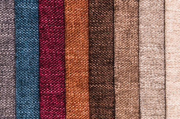 A set of samples of fabric furniture decoration lines of textile textures. Multicolored stripes upholstery. Mode and tone for a luxurious interior style. Abstract background
