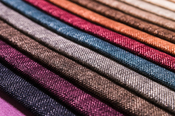 Close-up diagonal lines of textile upholstery in samples to select the color and fabric of the...