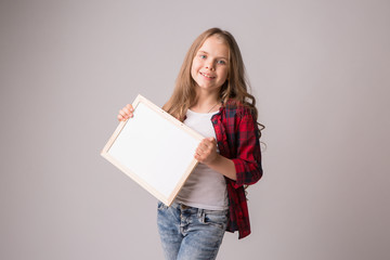 schoolgirl holding an empty drawing Board