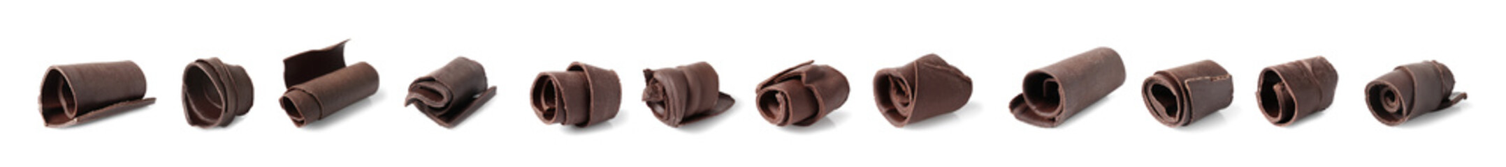 Set of delicious chocolate curls on white background