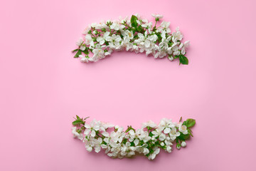 Flat lay composition of beautiful fresh spring flowers on color background, space for text