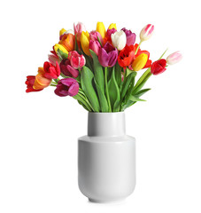 Vase with beautiful spring tulip flowers on white background
