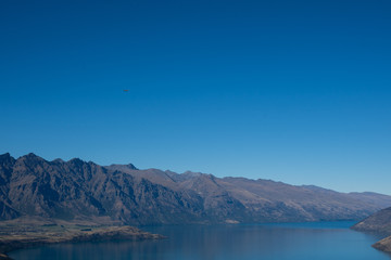 The view looking over Queenstown in New Zealand during summer on a sunny day