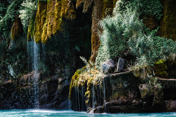 Waterfall flowing down a mountain covered with moss. Sulak Canyon, Dagestan